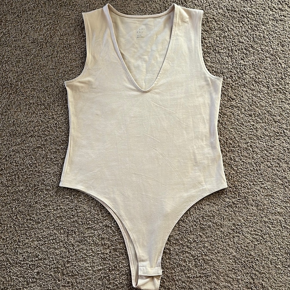 Medium Tan bodysuit never worn!